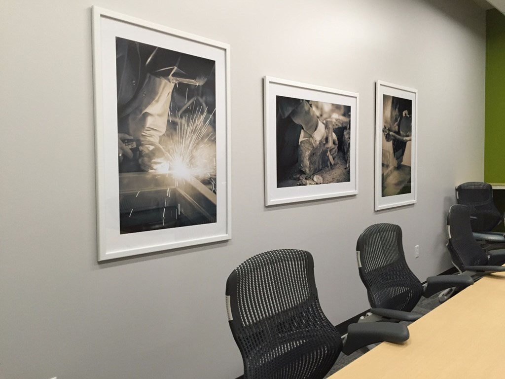 Festival Foods used enlarged photographs that feature the building in various stages of completion on wall in a conference room